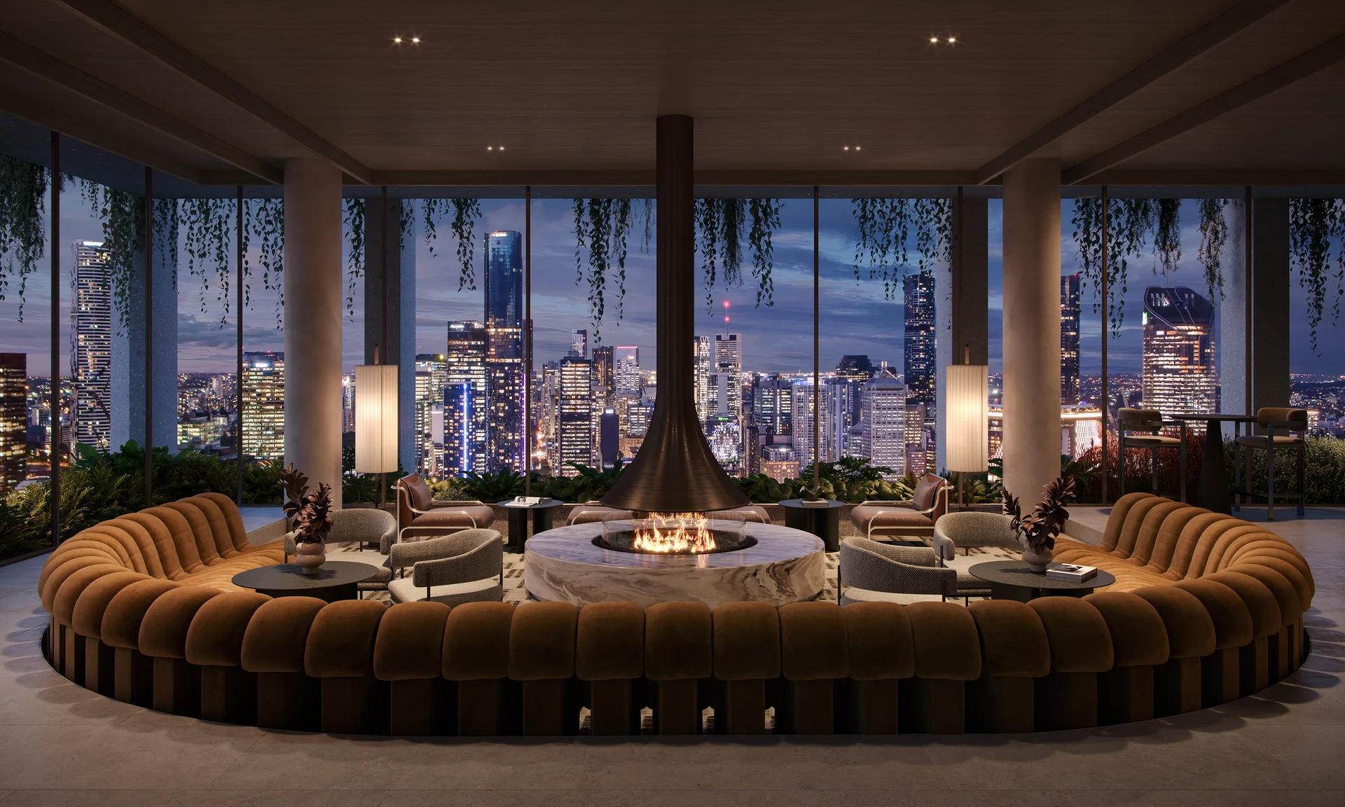 Elegant rooftop lounge with circular seating, central fireplace and panoramic city skyline views.