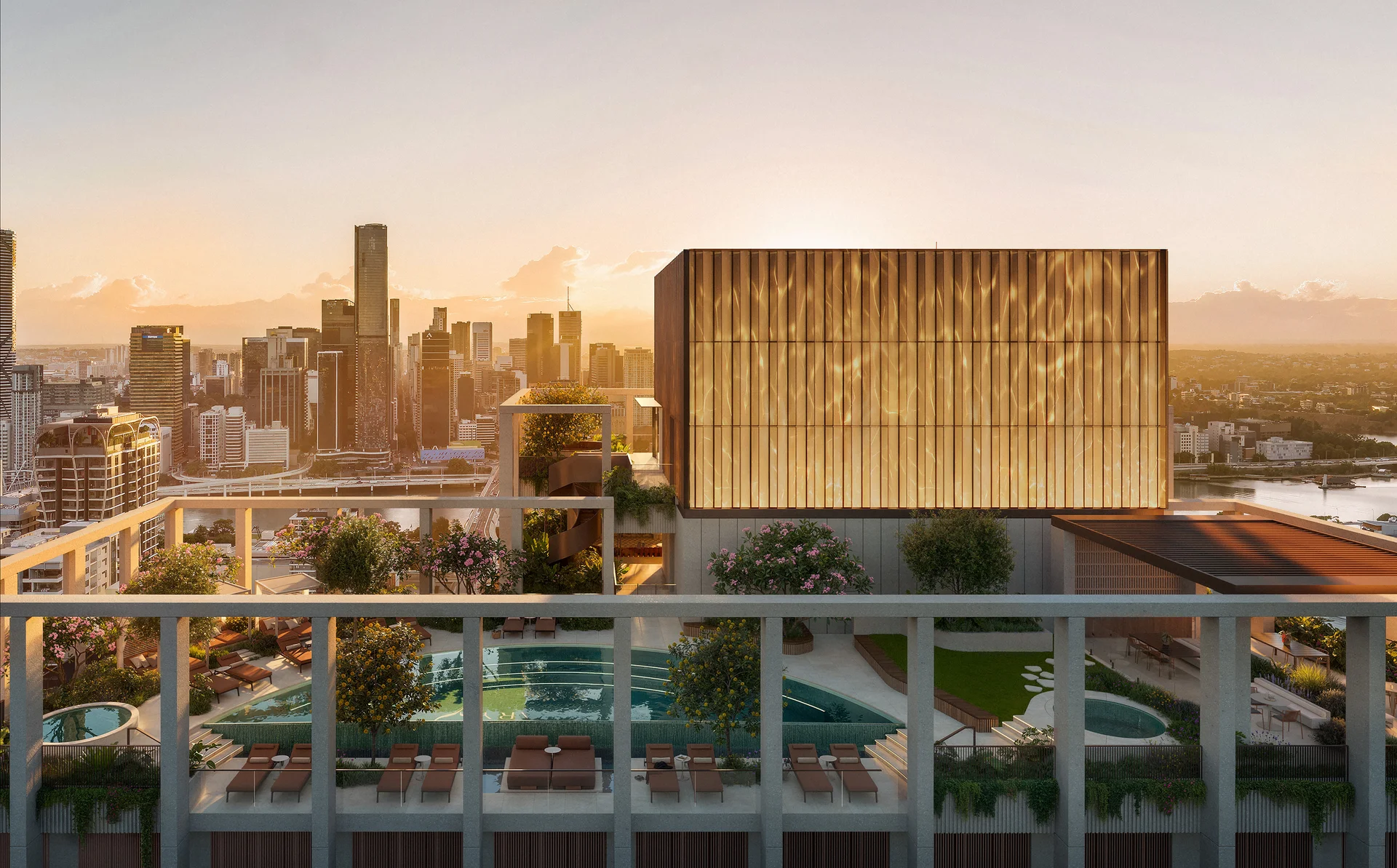 Rooftop pool terrace with sun loungers, gardens and city skyline views at sunset.