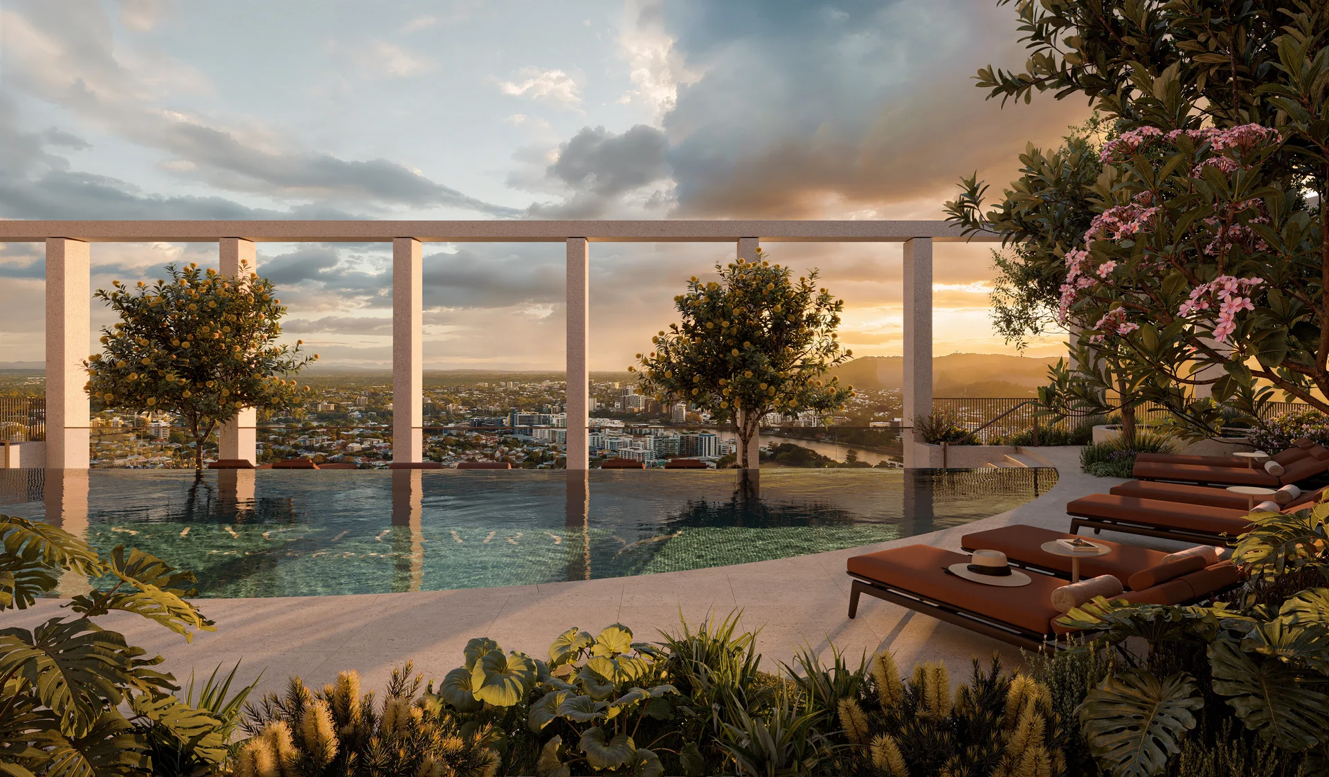 Infinity pool terrace with planted gardens, loungers and panoramic views at sunset.
