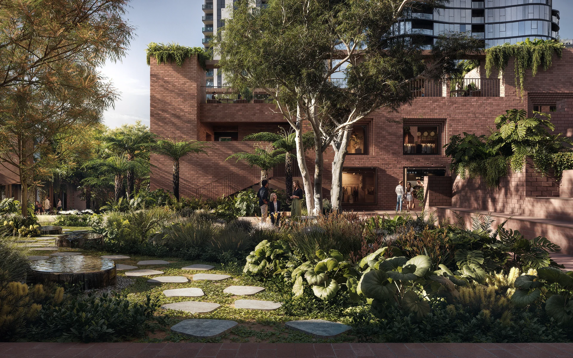 Landscaped residential garden with brick architecture, mature trees and communal seating areas.