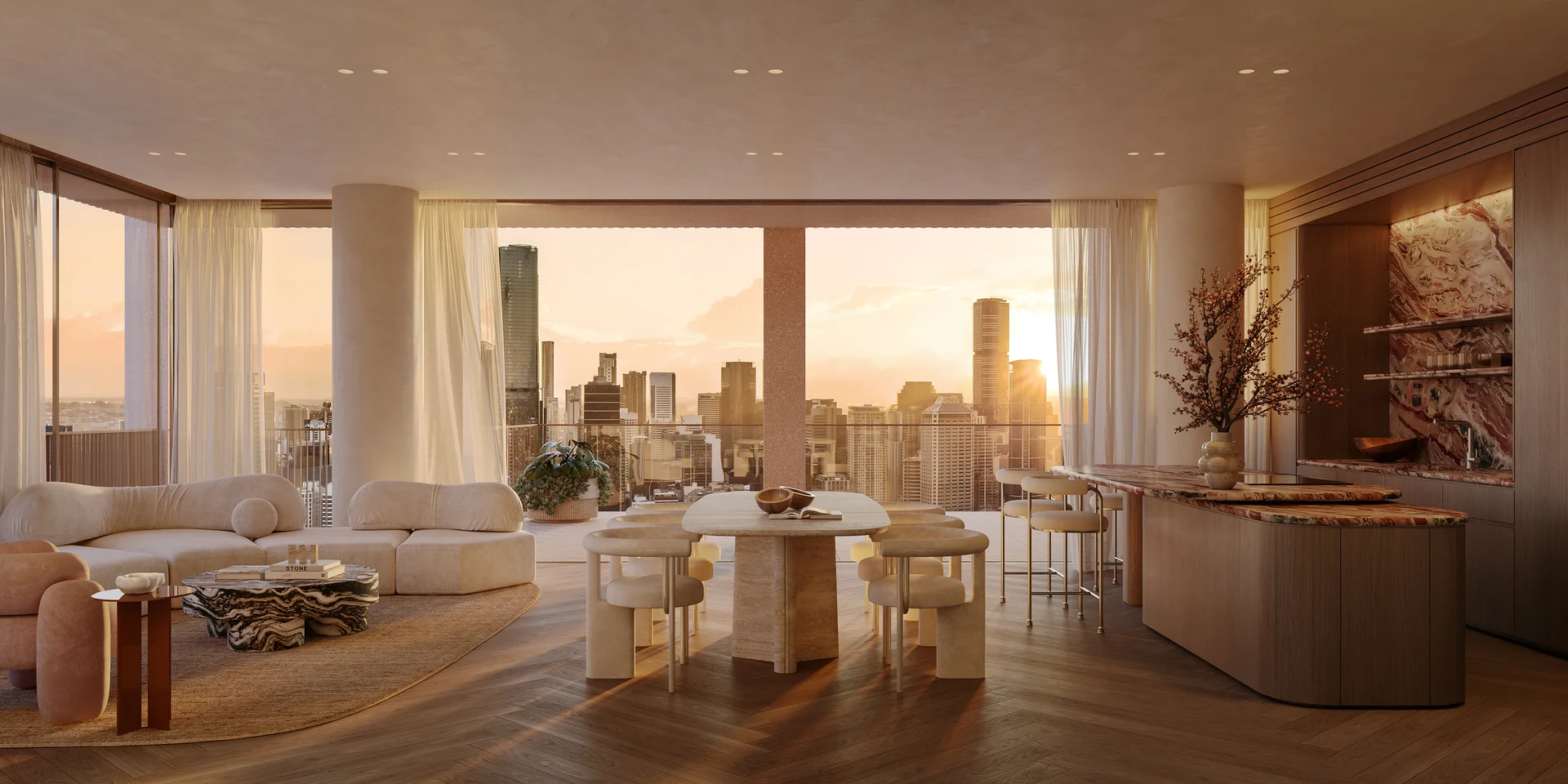 Luxury apartment interior with open-plan living, dining, kitchen area and sunset city views.